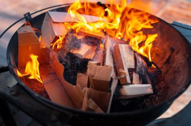 Barbecue grill with fire on open air close up photo